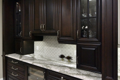 Dark Cabinets mixed with grey and beige countertops
