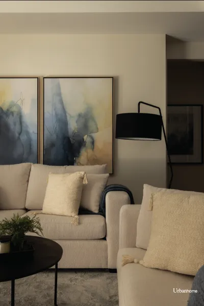 Cozy Living Room with Neutral Sofas and Abstract Art