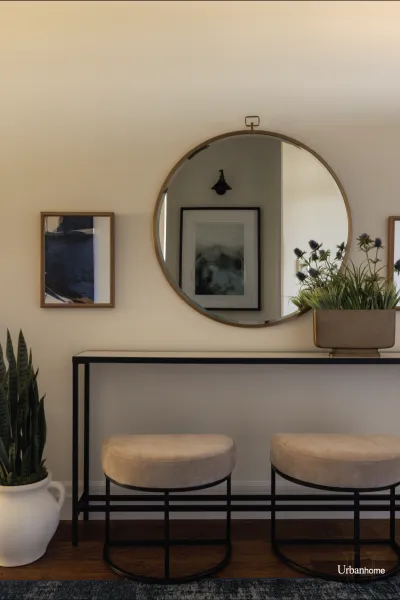 Elegant Entryway Design with Round Mirror & Velvet Stools