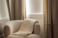 Serene Bedroom Corner with Cream Accent Chair