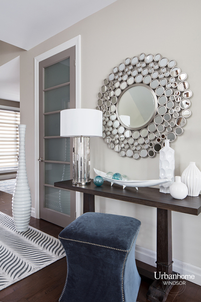 Console table with round mirror diving kitchen and living room
