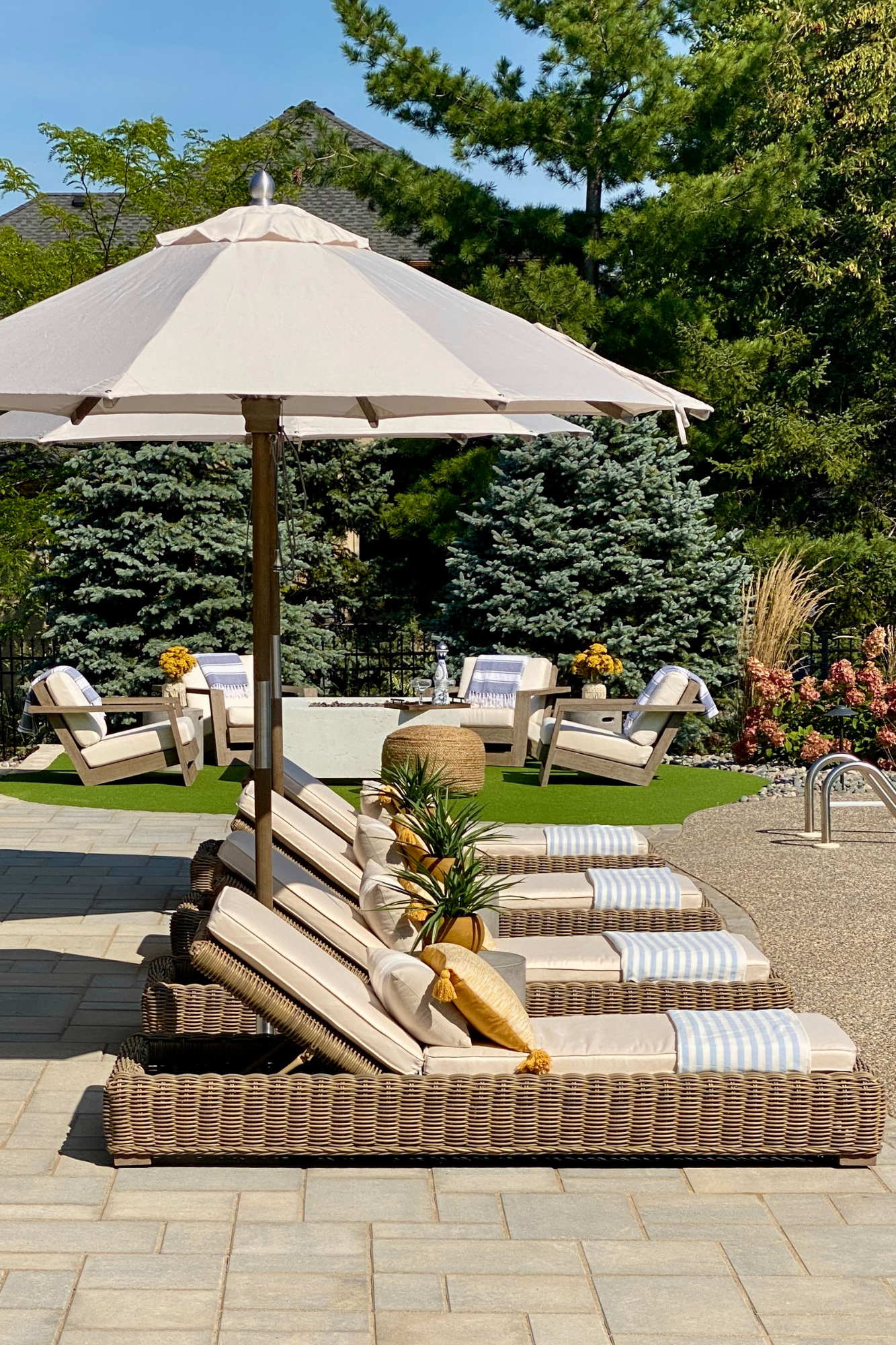 outdoor loungers next to pool for an interior design project.