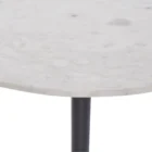 Round accent table with a sculptural black pedestal base and a smooth white marble top, shown in product detail, lifestyle, and material close-ups.