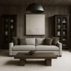 Modern neutral-tone sofa with structured arms and multiple throw pillows, shown in both studio and styled living room settings.