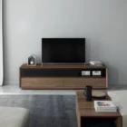 Rectangular walnut coffee table with a recessed black base drawer, open shelving, and clean modern lines, shown in studio and styled living room settings.
