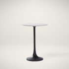 Round accent table with a sculptural black pedestal base and a smooth white marble top, shown in product detail, lifestyle, and material close-ups.
