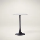 Round accent table with a sculptural black pedestal base and a smooth white marble top, shown in product detail, lifestyle, and material close-ups.