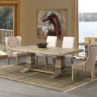 Rectangular solid wood dining table with a natural finish and dual pedestal base.