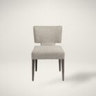 The Aniston Dining Chair featuring a sculpted mid-back silhouette, textured neutral upholstery, and tapered wood legs for a refined yet relaxed look.