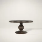 60-inch round pedestal dining table in dark-stained solid wood with a sculptural, turned base and smooth beveled edge.