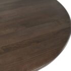 60-inch round pedestal dining table in dark-stained solid wood with a sculptural, turned base and smooth beveled edge.