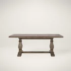 Rustic rectangular dining table with a thick wooden top and two carved pedestal legs connected by a stretcher base.