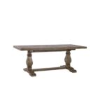 Rustic rectangular dining table with a thick wooden top and two carved pedestal legs connected by a stretcher base.