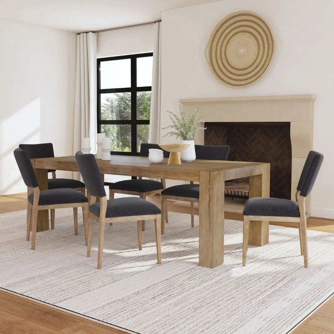A rustic modern rectangular dining table made of natural wood with thick, block-style legs and a clean-lined silhouette.