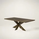 Modern rectangular dining table with a warm wood finish and an angular starburst pedestal base.