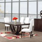 Metro Dining Table featuring a deep espresso finish and a sculptural U-shaped double pedestal base with a rectangular tabletop.