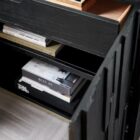 Small black accent chest with vertical wood texture and charred Shou Sugi Ban finish, resting on a subtle metallic plinth.