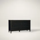 Black six-drawer dresser with brass knobs and lightly distressed finish.