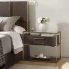 Modern wood and metal nightstand with glass top and two drawers.
