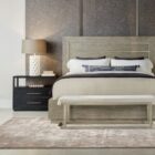 Black two-drawer nightstand with open shelf and textured wood grain.