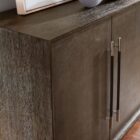 Dark wood entertainment console with four doors and vertical metallic handles, showcasing a modern and refined silhouette.