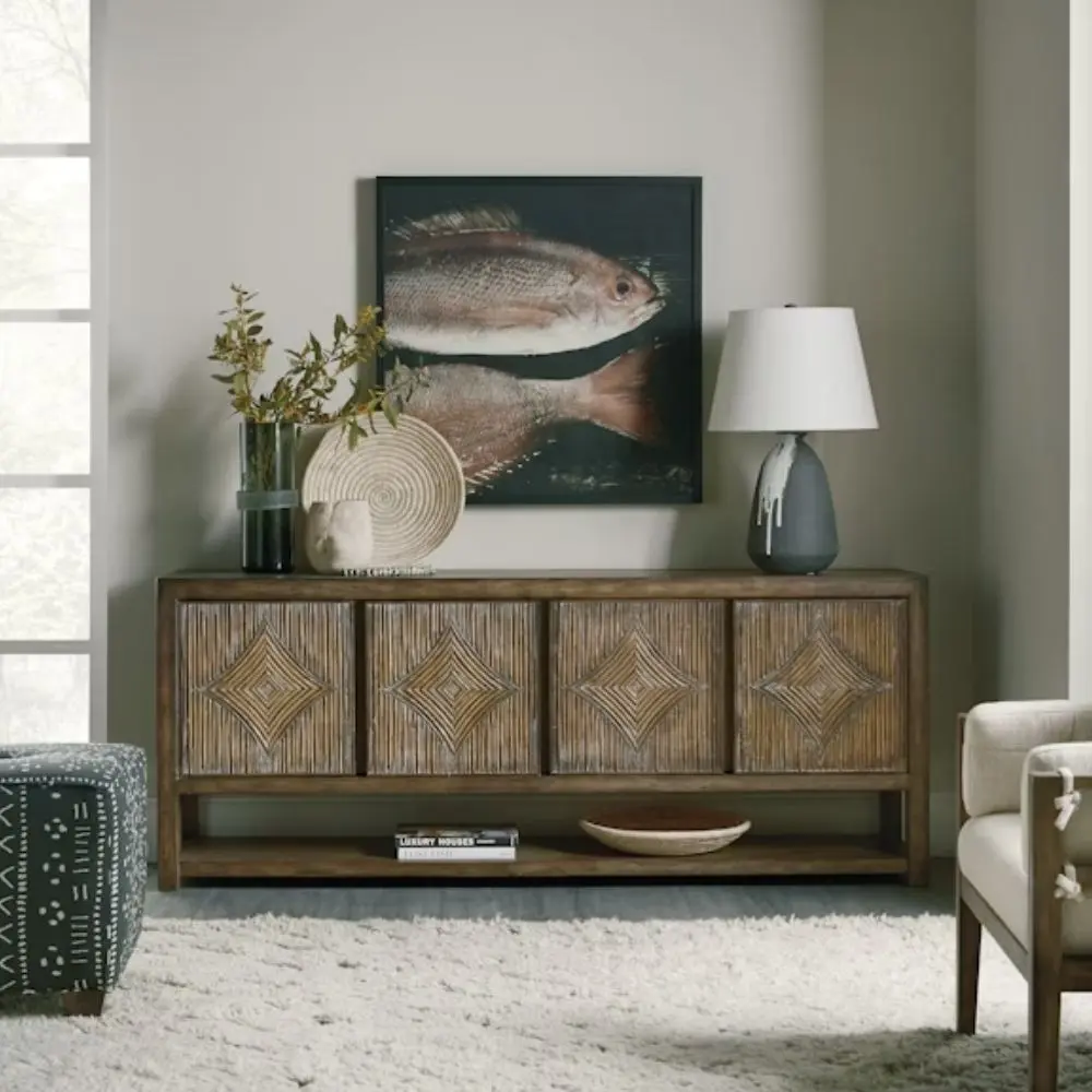Wooden entertainment console featuring diamond-patterned door fronts crafted from natural rattan in a rustic finish.