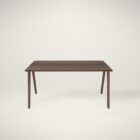 Minimalist walnut office desk with slim tapered legs and modern design.