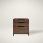 Three-drawer walnut wood cabinet with minimalist silhouette and integrated pulls.