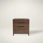 Three-drawer walnut wood cabinet with minimalist silhouette and integrated pulls.