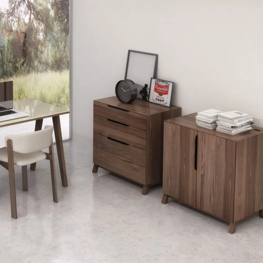 Three-drawer walnut wood cabinet with minimalist silhouette and integrated pulls.