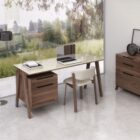 Modern walnut and cream office desk with slim legs and integrated storage drawers