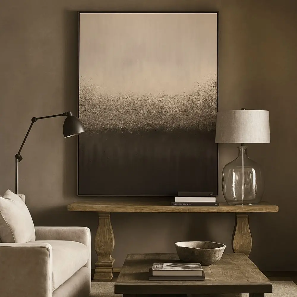A contemporary abstract art piece featuring a soft ombré gradient that transitions from light beige to deep charcoal, with textured, mist-like details across the center.