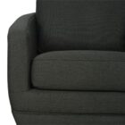 Modern club chair with plush cushions, curved arms, and dark wooden legs.