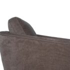Modern club chair with plush cushions, curved arms, and dark wooden legs.