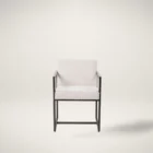 The LH Imports Breve Dining Chair features a softly curved upholstered seat in a neutral tone, supported by warm wood legs with a mid-century silhouette.