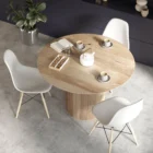 Round natural wood dining table with a fluted cylindrical pedestal base and smooth tabletop.