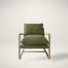 Mid-century inspired club chair with weathered wood frame and deep green cushions