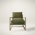 Mid-century inspired club chair with weathered wood frame and deep green cushions