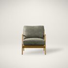 Mid-century inspired armchair with oak wood frame and deep green upholstered cushions.