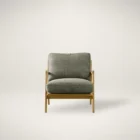 Mid-century inspired armchair with oak wood frame and deep green upholstered cushions.