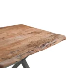 Rectangular live-edge wood dining table with a natural finish and matte black metal cross-frame legs.