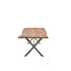 Rectangular live-edge wood dining table with a natural finish and matte black metal cross-frame legs.