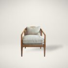 Contemporary accent chair with light boucle cushions and natural wood frame featuring open cane sides.