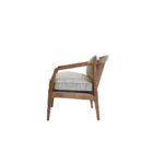 Contemporary accent chair with light boucle cushions and natural wood frame featuring open cane sides.
