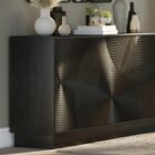 Black wooden sideboard with dramatic concentric carved patterns across its double-door front.
