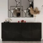 Black wooden sideboard with dramatic concentric carved patterns across its double-door front.