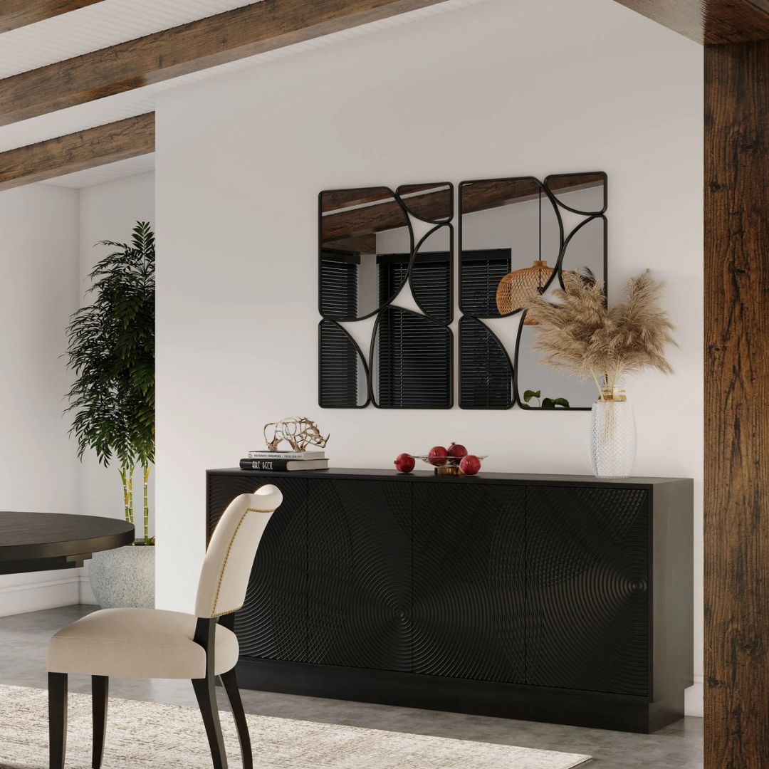 Black wooden sideboard with dramatic concentric carved patterns across its double-door front.