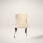revi Dining Chair featuring soft cream boucle-style fabric with slim black metal legs.