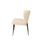revi Dining Chair featuring soft cream boucle-style fabric with slim black metal legs.