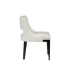Barilla Dining Chair featuring an off-white upholstered seat with a sleek cut-out backrest and dark wooden legs.
